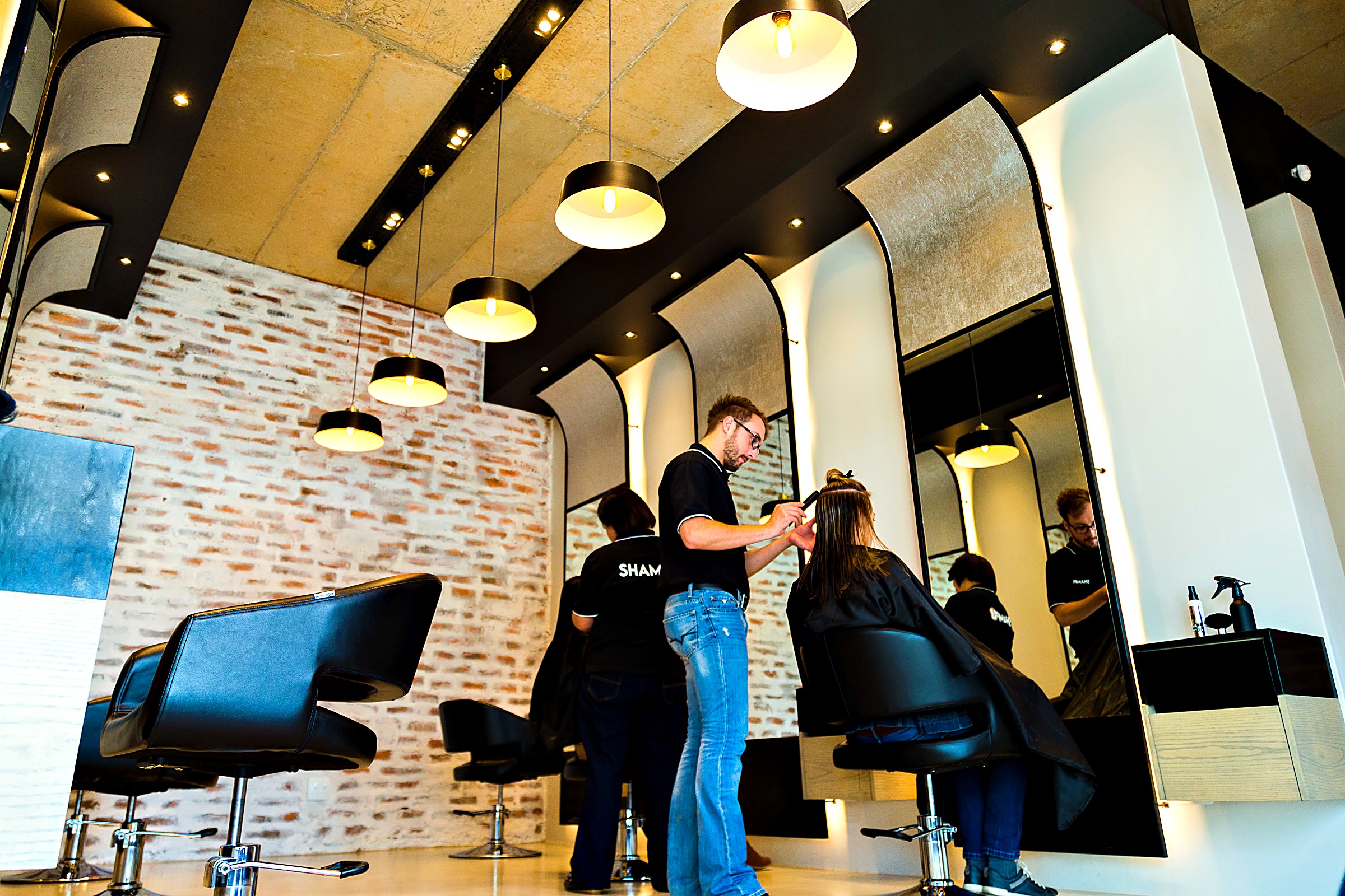 A stylist at work inside the ShampU hair studio in George